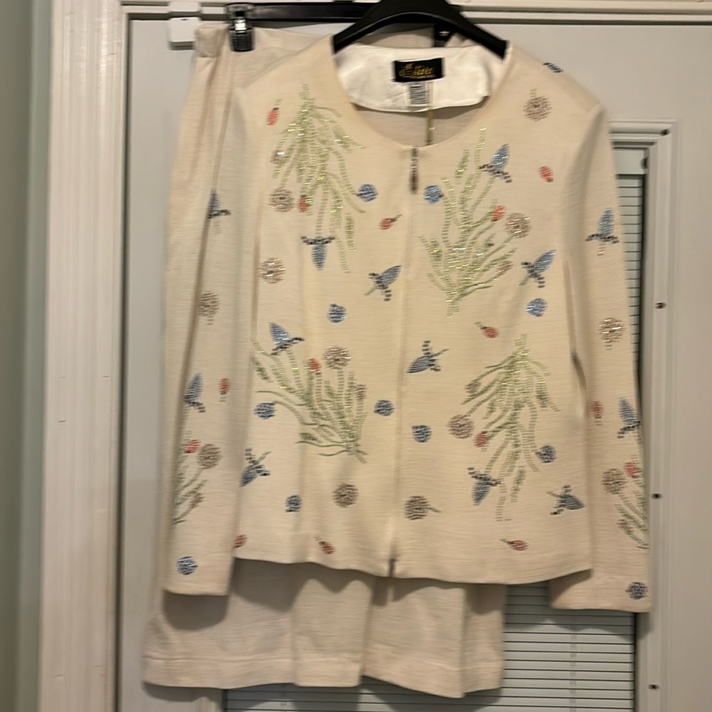 Beautiful off white knit suit with embellishments, designed by Elite Champagne.